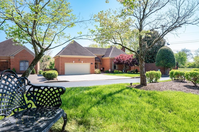 100 Carriage Way, Hendersonville, TN 37075 - view of front facade with brick siding, an attached garage, and driveway
