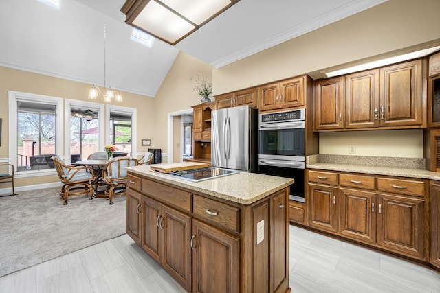 100 Carriage Way, Hendersonville, TN 37075 - kitchen with stainless steel appliances, brown cabinetry, hanging light fixtures, a kitchen island, and light colored carpet
