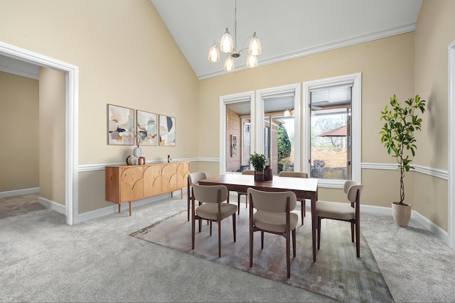 100 Carriage Way, Hendersonville, TN 37075 - dining room with light carpet, a chandelier, baseboards, crown molding, and high vaulted ceiling