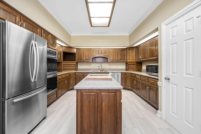 100 Carriage Way, Hendersonville, TN 37075 - kitchen with stainless steel appliances, a sink, crown molding, a center island, and light stone counters
