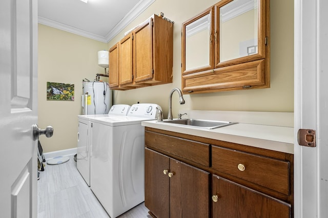 100 Carriage Way, Hendersonville, TN 37075 - laundry room with water heater, cabinet space, independent washer and dryer, crown molding, and baseboards