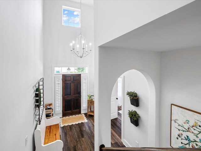 3005 Langston Pl, Spring Hill, TN 37174 - foyer entrance featuring a towering ceiling, wood finished floors, a chandelier, and arched walkways