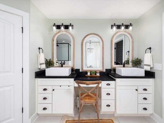 3005 Langston Pl, Spring Hill, TN 37174 - bathroom with double vanity, tile patterned floors, and a shower