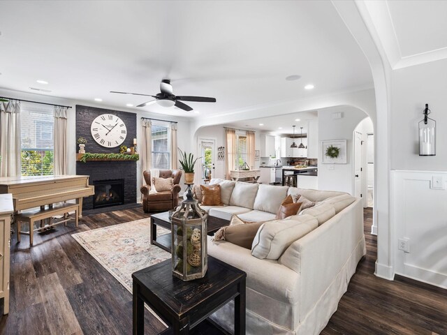 3005 Langston Pl, Spring Hill, TN 37174 - living area with arched walkways, ceiling fan, plenty of natural light, ornamental molding, and recessed lighting