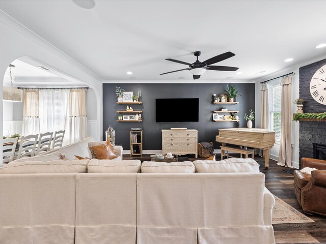 3005 Langston Pl, Spring Hill, TN 37174 - living area with ceiling fan, dark wood-style flooring, crown molding, a large fireplace, and recessed lighting