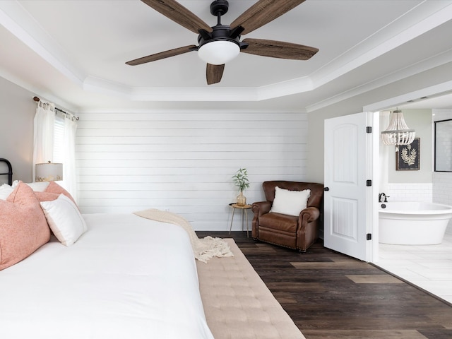 3005 Langston Pl, Spring Hill, TN 37174 - bedroom featuring a tray ceiling, ornamental molding, wood finished floors, a chandelier, and a ceiling fan