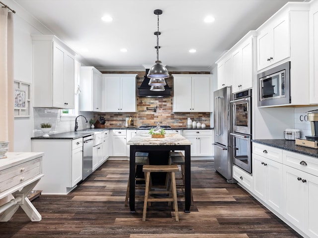 3005 Langston Pl, Spring Hill, TN 37174 - kitchen with appliances with stainless steel finishes, custom exhaust hood, tasteful backsplash, recessed lighting, and dark wood-style floors