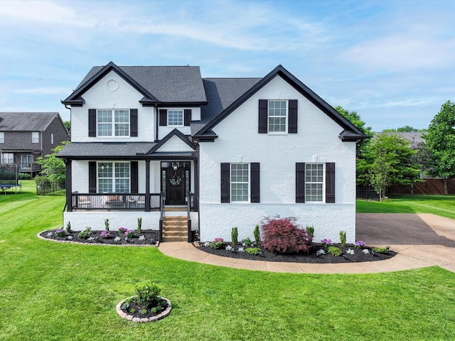 3005 Langston Pl, Spring Hill, TN 37174 - view of front of property with brick siding, covered porch, and a shingled roof