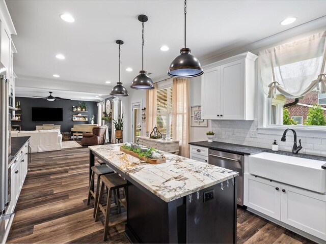 3005 Langston Pl, Spring Hill, TN 37174 - kitchen with a sink, dishwasher, a kitchen island, open floor plan, and recessed lighting
