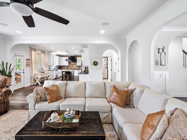 3005 Langston Pl, Spring Hill, TN 37174 - living room with arched walkways, a ceiling fan, crown molding, dark wood-style floors, and recessed lighting
