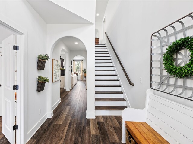 3005 Langston Pl, Spring Hill, TN 37174 - foyer with arched walkways, dark wood-type flooring, stairs, baseboards, and recessed lighting