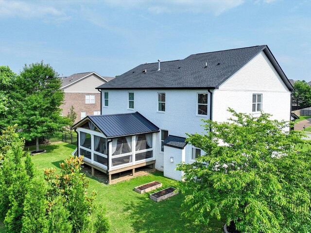 3005 Langston Pl, Spring Hill, TN 37174 - rear view of property featuring a sunroom, a garden, and roof with shingles
