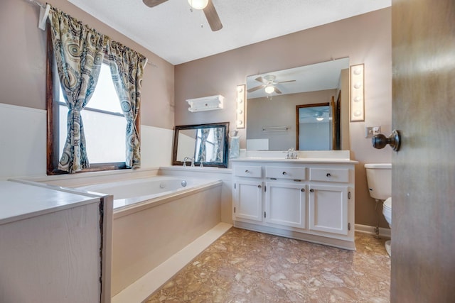 239 Henry Bayless Rd, Ardmore, TN 38449 - bathroom featuring ceiling fan, toilet, vanity, and a bath