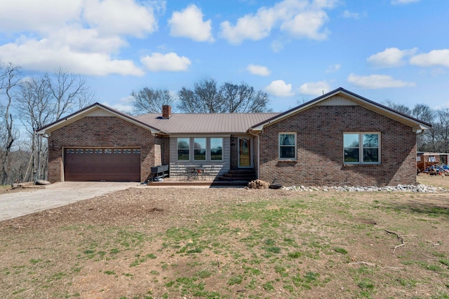 239 Henry Bayless Rd, Ardmore, TN 38449 - single story home featuring brick siding, an attached garage, driveway, a chimney, and entry steps