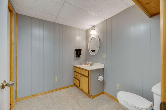 239 Henry Bayless Rd, Ardmore, TN 38449 - bathroom featuring toilet, vanity, baseboards, a decorative wall, and a paneled ceiling