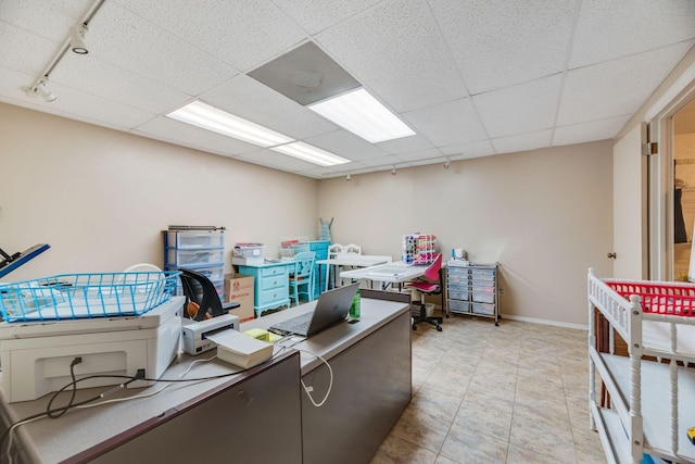 239 Henry Bayless Rd, Ardmore, TN 38449 - office area with track lighting, baseboards, a paneled ceiling, and light tile patterned floors