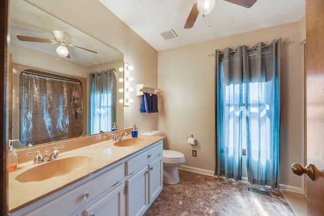 239 Henry Bayless Rd, Ardmore, TN 38449 - bathroom featuring a ceiling fan, healthy amount of natural light, toilet, and baseboards