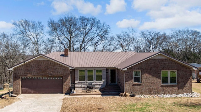 239 Henry Bayless Rd, Ardmore, TN 38449 - ranch-style home featuring brick siding, an attached garage, concrete driveway, a chimney, and metal roof