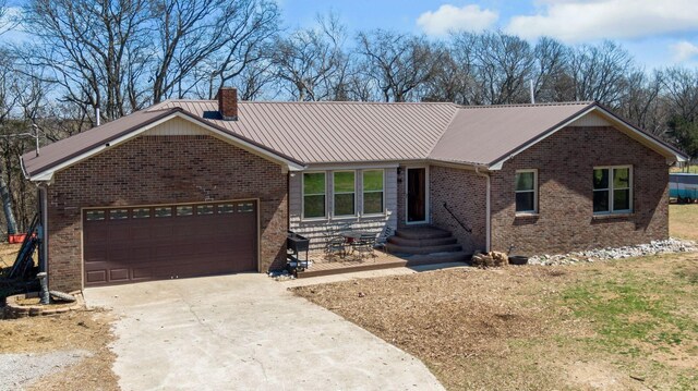 239 Henry Bayless Rd, Ardmore, TN 38449 - ranch-style house with brick siding, driveway, a garage, and a chimney