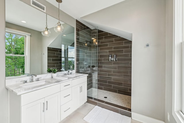 954 Russell St, Nashville, TN 37206 - full bath featuring double vanity, a stall shower, recessed lighting, and tile patterned flooring