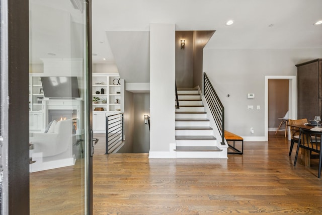 954 Russell St, Nashville, TN 37206 - stairs with wood finished floors, recessed lighting, built in shelves, and baseboards