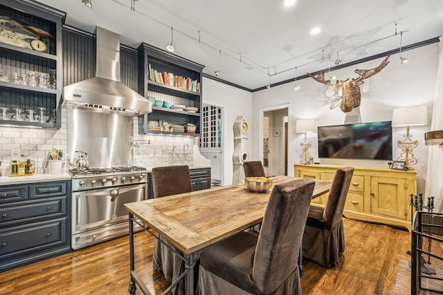4235 Columbia Pike, Franklin, TN 37064 - kitchen featuring open shelves, wall chimney exhaust hood, stainless steel range, wood finished floors, and decorative backsplash