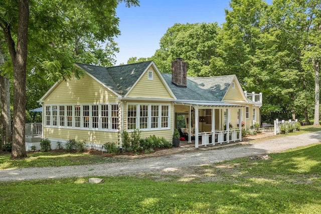4235 Columbia Pike, Franklin, TN 37064 - rear view of house with a chimney, a yard, roof with shingles, and dirt driveway