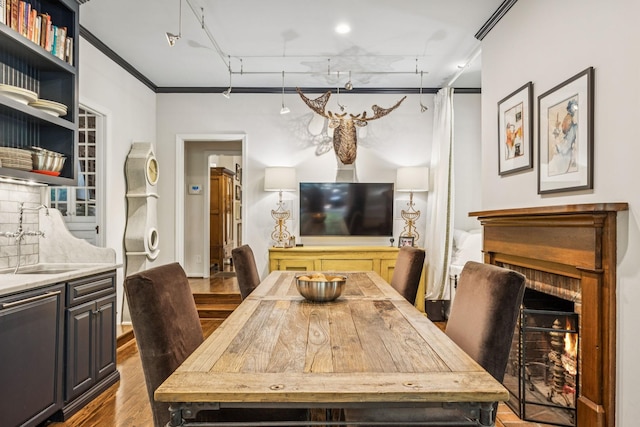 4235 Columbia Pike, Franklin, TN 37064 - dining space with wood finished floors and a warm lit fireplace