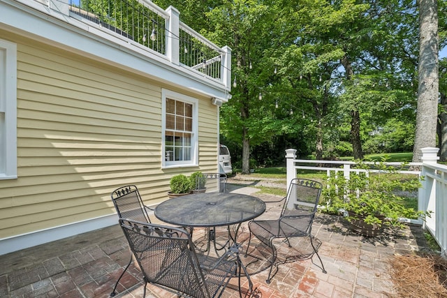 4235 Columbia Pike, Franklin, TN 37064 - view of patio / terrace featuring a balcony, outdoor dining space, and view of wooded area