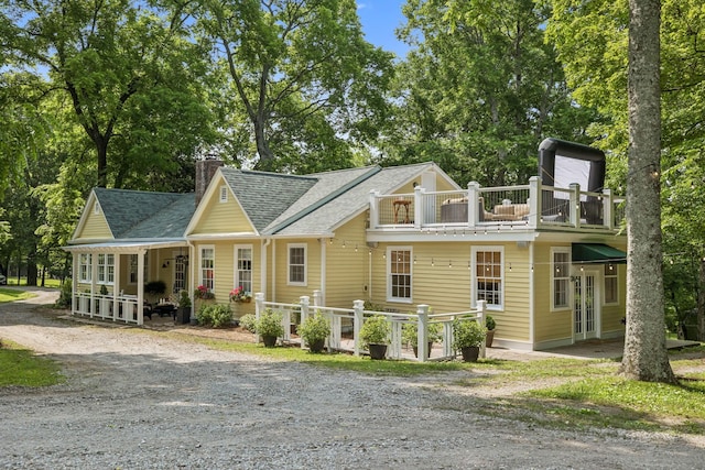 4235 Columbia Pike, Franklin, TN 37064 - view of front facade with a balcony, a chimney, and a shingled roof