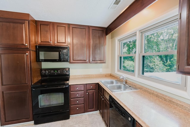 109 Hobbs Dr, Columbia, TN 38401 - kitchen featuring black appliances, a sink, and light countertops