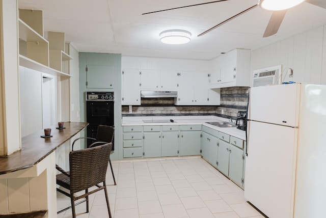 109 Hobbs Dr, Columbia, TN 38401 - kitchen featuring freestanding refrigerator, under cabinet range hood, decorative backsplash, a sink, and a wall mounted AC
