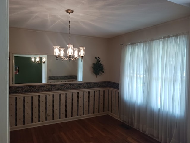 166 Westview St, Camden, TN 38320 - spare room with wood finished floors, wainscoting, and a chandelier