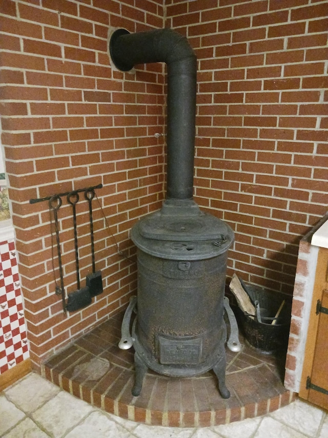 166 Westview St, Camden, TN 38320 - detailed view of a wood stove and brick wall