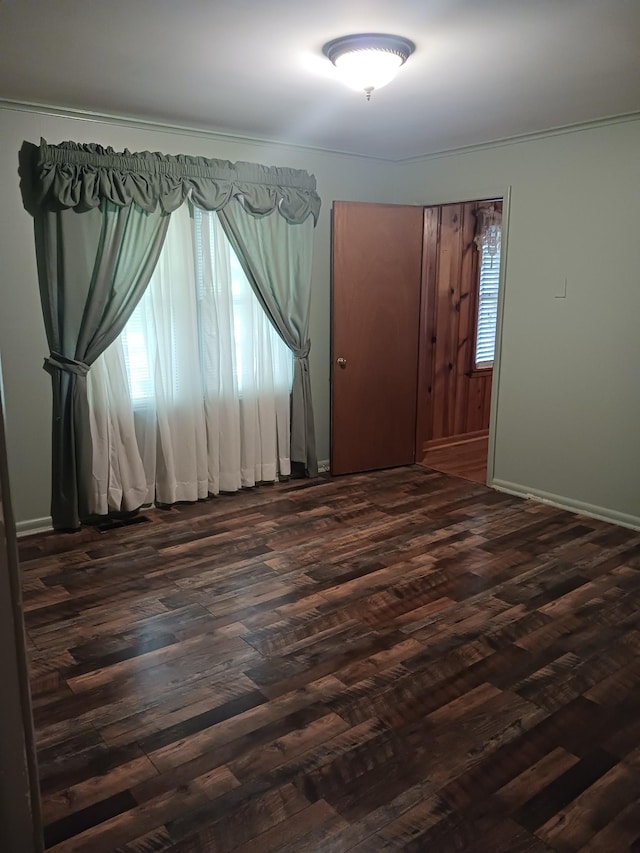 166 Westview St, Camden, TN 38320 - empty room featuring dark wood finished floors and baseboards
