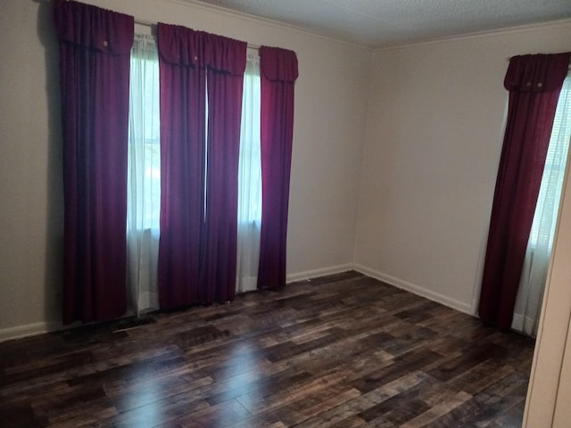 166 Westview St, Camden, TN 38320 - spare room with dark wood finished floors, baseboards, and crown molding
