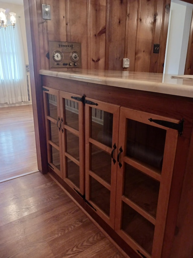 166 Westview St, Camden, TN 38320 - detailed view of wood finished floors, a chandelier, and wood walls