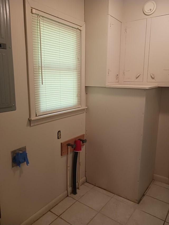166 Westview St, Camden, TN 38320 - laundry area with light tile patterned flooring and baseboards