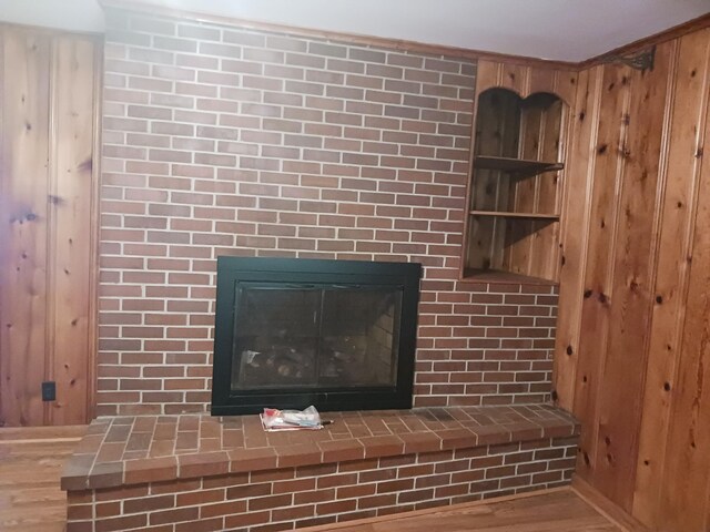 166 Westview St, Camden, TN 38320 - detailed view of wood finished floors and a fireplace