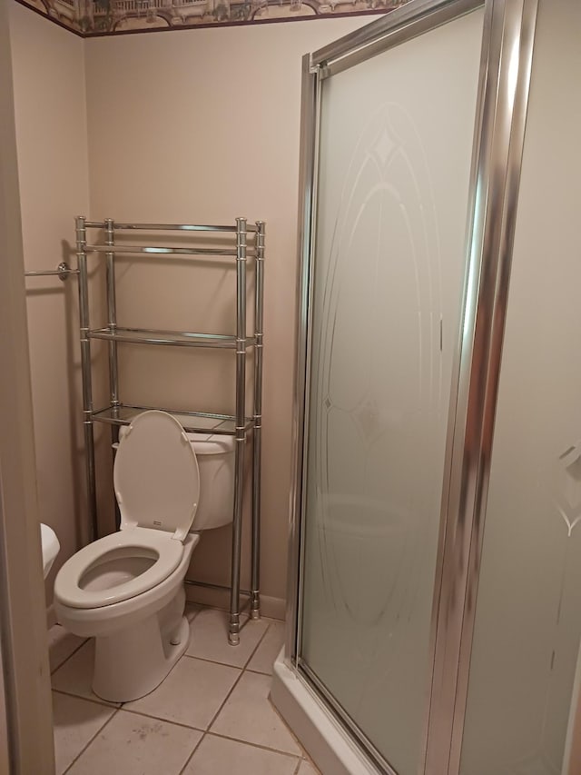 166 Westview St, Camden, TN 38320 - bathroom featuring a stall shower, toilet, and tile patterned floors