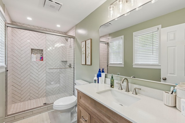 307 S Hummingbird Ln, Dickson, TN 37055 - full bath with toilet, vanity, a stall shower, and recessed lighting