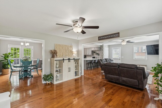 307 S Hummingbird Ln, Dickson, TN 37055 - living room featuring a ceiling fan, healthy amount of natural light, and wood finished floors