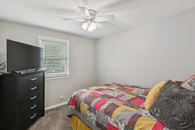 307 S Hummingbird Ln, Dickson, TN 37055 - bedroom with dark colored carpet, ceiling fan, and baseboards