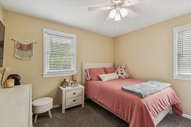 307 S Hummingbird Ln, Dickson, TN 37055 - bedroom with dark carpet, multiple windows, baseboards, and a ceiling fan