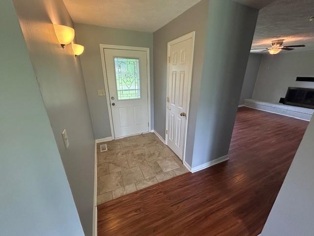 203 Arnold Ave, Tullahoma, TN 37388 - foyer featuring ceiling fan, baseboards, and wood finished floors