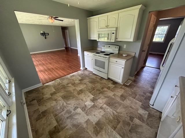 203 Arnold Ave, Tullahoma, TN 37388 - kitchen with white appliances, ceiling fan, and baseboards