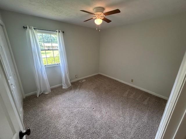 203 Arnold Ave, Tullahoma, TN 37388 - empty room featuring ceiling fan, carpet, and baseboards