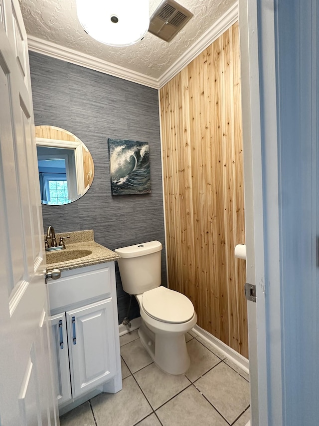 512 Riverview Dr, Franklin, TN 37064 - half bathroom featuring vanity, toilet, tile patterned flooring, ornamental molding, and baseboards