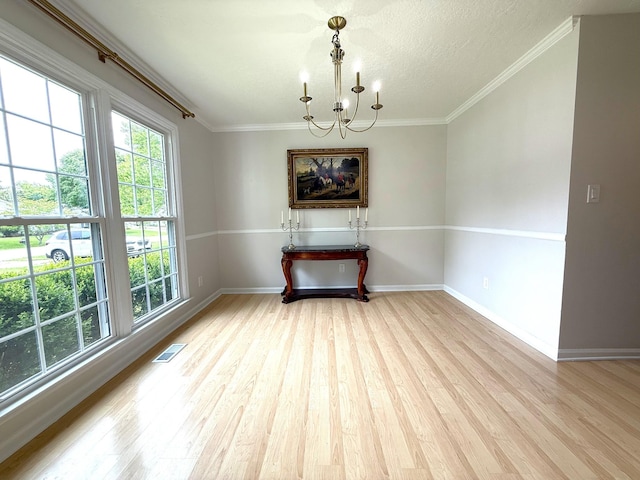 512 Riverview Dr, Franklin, TN 37064 - spare room featuring a chandelier, wood finished floors, baseboards, crown molding, and a textured ceiling