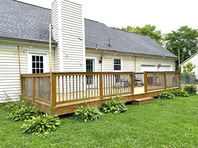 512 Riverview Dr, Franklin, TN 37064 - rear view of house featuring roof with shingles, a chimney, a deck, and a lawn